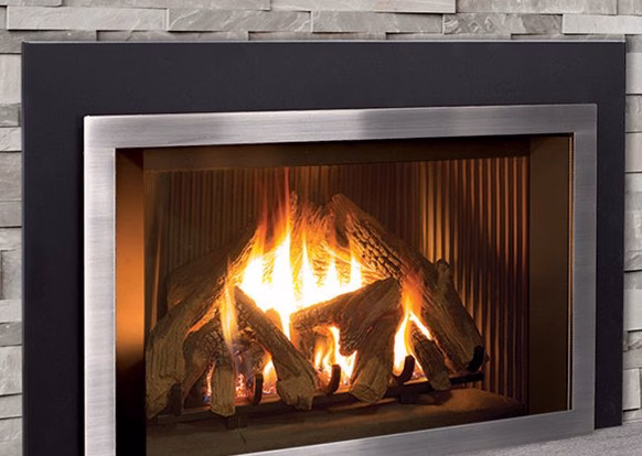 Propane Fireplace Propane fireplace insert with burning logs in a gray stacked-stone wall